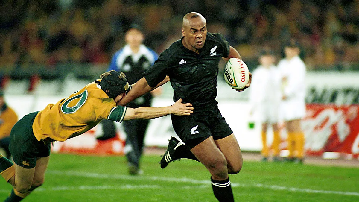 Jonah Lomu breaking through a tackle against Australia