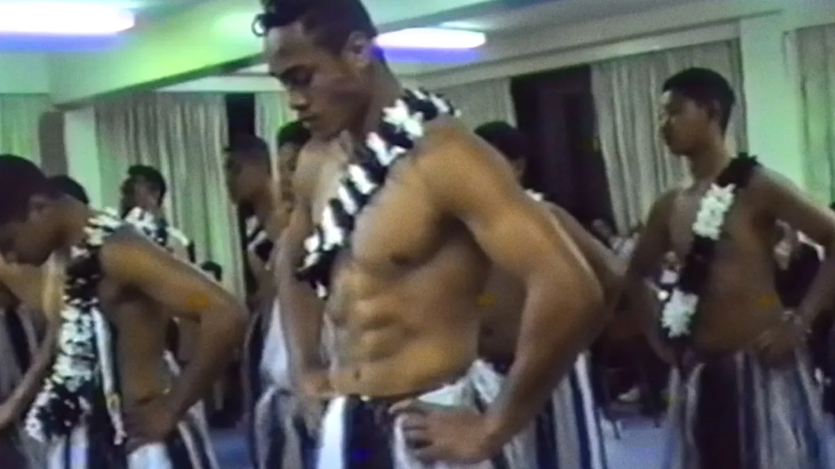 Young Pasifika men preparing for a cultural performance